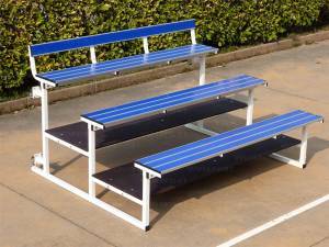 Compact stand use 2 mt with 3 steps in painted steel, foldable and mobile on wheels. Seat with beams in anodized aluminium with film in PVC in blue colour.